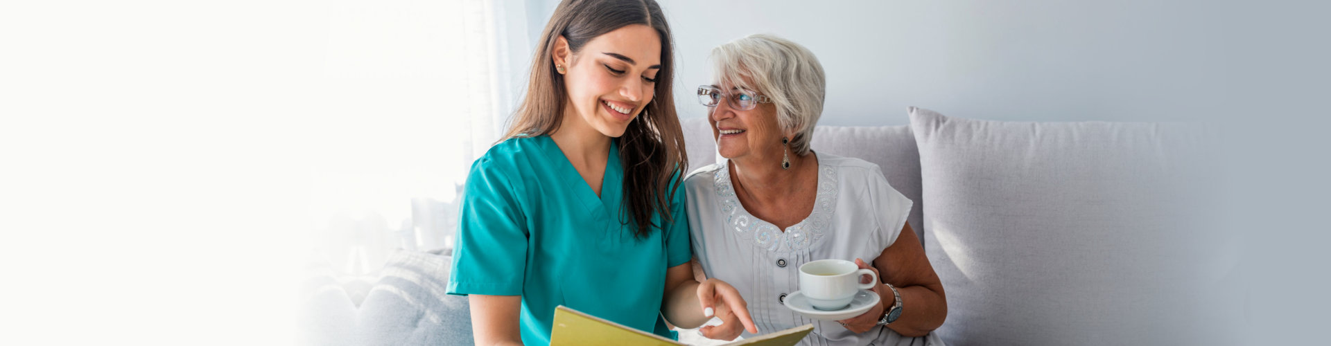 senior woman looking at the female caregiver